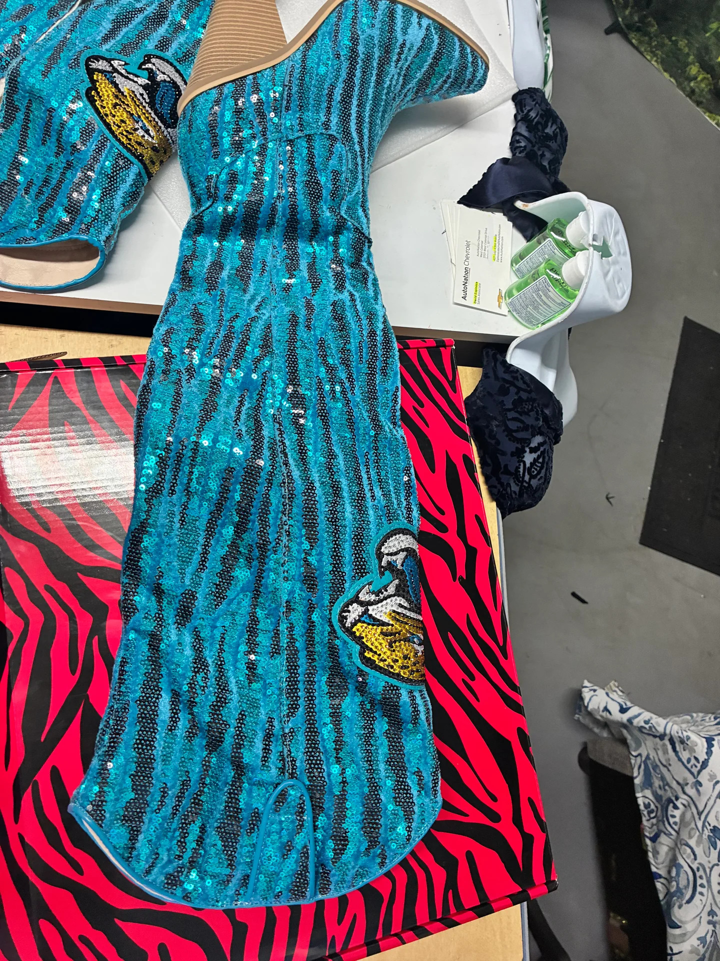 Custom teal sequin dress with appliqué patches